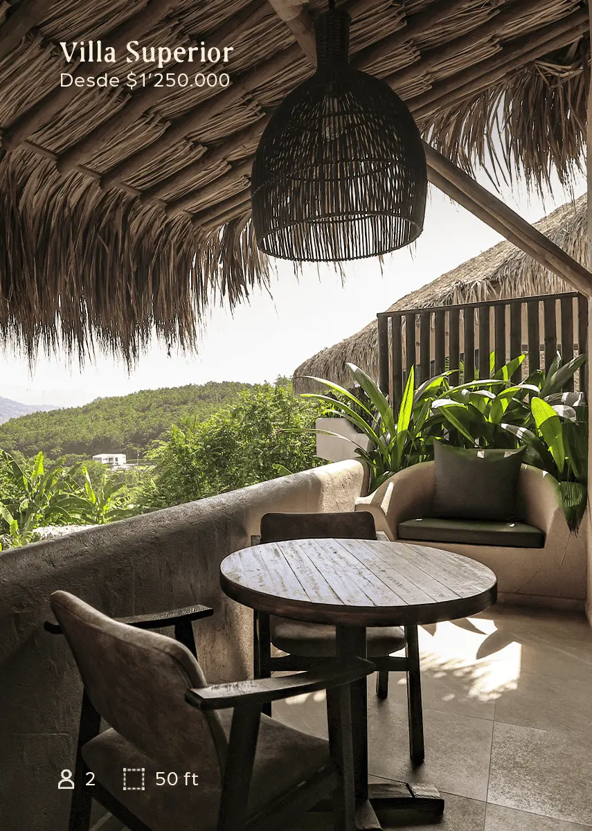 Promotional terrace scene for Villa Superior with a round wooden table, chairs, lush plants, and a hillside view; text reads "Villa Superior Desde $1,250,000".